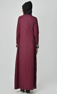 A perfect wardrobe piece for minimalistic style Round neck A stylish abaya with embroidered front and sleeves Includes both side pockets Full Sleeves FABRIC: Cotton Jersey CARE: Machine wash cold Eid Long Sleeve Abaya With Floral Embroidery, Eid Abaya With Floral Embroidery And Long Sleeves, Festive Long Sleeve Thobe With Floral Embroidery, Long Sleeve Abaya With Modesty Panel For Fall, Maxi Length Abaya For Fall Workwear, Fall Long Sleeve Abaya With Modesty Panel, Modest Long Sleeve Thobe For Eid, Fall Workwear Abaya In Maxi Length, Fall Workwear Maxi Length Abaya