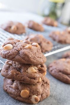 a stack of cookies sitting on top of a cooling rack