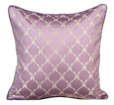 a purple and white pillow with an intricate design on the front, along with a gold border