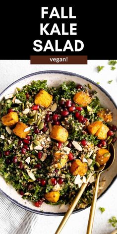 a salad with kale, cranberries and almonds in a white bowl