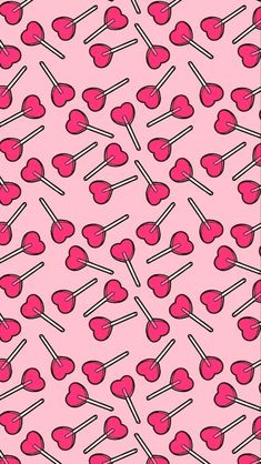 pink candy lollipops are arranged in rows on a pink background with black and white lines