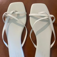 These Beautiful Off-White Everlane Sandals Are New, Never Worn. I Bought Them At A Sample Sale Last Summer, But My Feet Were Too Wide For Them. The Last Picture Is To Show How The Straps Would Lay On The Top Of Your Foot. I Was Unable To Find Images Of Them Online, So They Are Either No Longer Sold Or A Sample. Would Love To Give These A Great Home! White Strappy Summer Sandals, White Strappy Sandals For Summer, Adjustable White Sandals For Spring, White Strappy Casual Sandals, Casual White Strappy Sandals, White Adjustable Sandals For Day Out, Chic White Flip Flops For Vacation, White Flat Sandals For Spring, White Flat Flip Flops For Spring