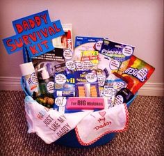 the baby survival kit is in a blue basket on the floor next to a gray wall