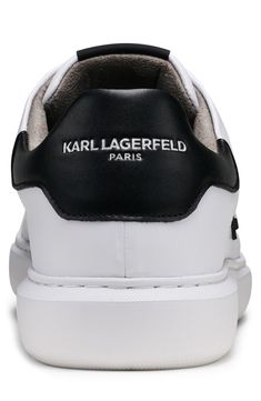 An Iconic Karl Lagerfeld image details the sides of these crisp white sneakers for casual days. Round toe Lace-up vamp Padded collar White sole Leather and synthetic upper, synthetic sole Imported Casual High-top Sneakers With Logo And White Sole, Casual Lace-up Sneakers With Logo, Casual High-top Sneakers With Logo And Round Toe, Casual White High-top Sneakers With Logo, Casual High-top Sneakers With Logo, Classic High-top Sneakers With Logo For Streetwear, Casual Lace-up High-top Sneakers With Logo, Casual White Sneakers With Logo, Classic White High-top Sneakers With Logo Print