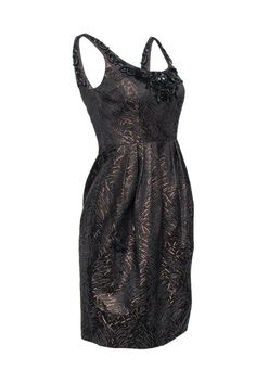 Jewels and shimmer and shine! This dress from Carmen Marc Valo has it all! This piece features a metallic exterior and jewels that are perfect for your next night out. Pair with gold accessories and you'll be sure to make a statement. Size 2 Shell: 51% Cotton, 41% Acetate, 8% Polyester Lining: 100% Acetate Concealed back zipper Lined Shift silhouette Scoop neckline w/ black jewel embellishment Sleeveless Brown and bronze metallic print design Pleated skirt Bust 30" Waist 30" Shoulder to hem 37" Carmen Marc Valvo, Black Jewel, Shimmer And Shine, Metallic Prints, Gold Accessories, Scoop Neckline, Pleated Skirt, Shift Dress, Night Out