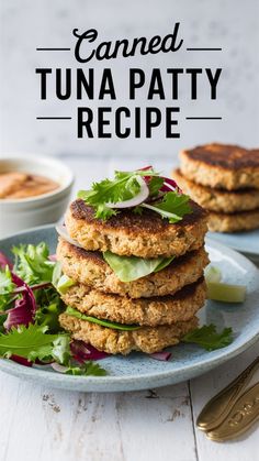 a stack of tuna patty patties on a plate with lettuce and radishes