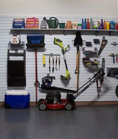 a garage with tools and equipment on the wall