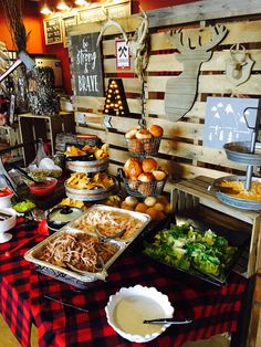 a buffet table filled with lots of food