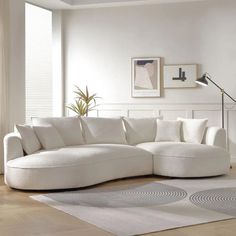 a large white sectional sofa in a living room