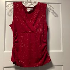 Sleeveless Red Tank Top With Sparkle Accents. Never Worn Red Sleeveless Tank Top For Night Out, Red Stretch Tank Top For Party, Stretch Red Tank Top For Party, Sleeveless Summer Holiday Tops, Sleeveless Tops For Summer Holiday, Red Sleeveless Blouse For Party, Elegant Red Tank Top For Night Out, Elegant Red V-neck Tank Top, Sleeveless Tops For Spring Holiday