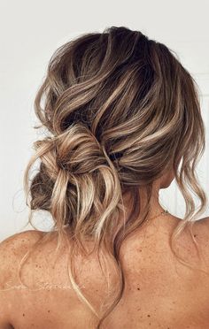 21. Beachy, Effortless Messy Low Bun When it comes to hairdo, the updo is one elegant hair style that never does seem to go... Messy Low Bun, Bridesmaid Hair Inspo, Hair Hoco, Wedding Guest Hairstyles