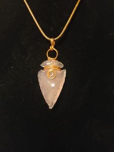 This rose quartz arrowhead is even more lovely in person. The camera really doesn't capture the pink like seeing it with your own eyes. This unique piece has been hand wrapped in tarnish resistant Parawire brand wire and comes on an 18 inch cord. Arrowhead Wire Wrapping, Wire Wrapped Arrowhead Tutorial, Wire Wrap Arrowhead, Wire Wrapped Arrowhead, Arrowheads Jewelry, Arrow Head, Arrowhead Necklace, Gem Necklace, Hand Wrap