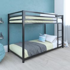 a bunk bed in a room with blue walls and white flooring on the side