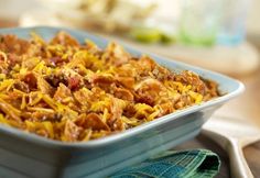 a casserole dish filled with meat and cheese