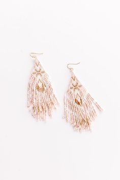 - Show your bubbly side with these beautifully boho beaded earrings! Intricately designed dangling beaded earrings featuring ivory, gold, and pink hues - Hook backs - Size: 4.5 inches Handmade White Chandelier Earrings For Festive Occasions, White Chandelier Earrings With Dangling Beads For Festivals, Festive Handmade White Chandelier Earrings, White Bohemian Chandelier Earrings For Festive Occasions, Bohemian White Chandelier Earrings For Festive Occasions, Pink Bohemian Beaded Earrings For Festive Occasions, Bohemian Pink Beaded Earrings For Festive Occasions, Festive White Handmade Chandelier Earrings, Festive White Earrings With Colorful Beads