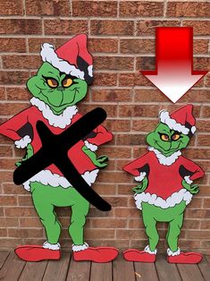 two cut outs of the same character standing in front of a brick wall with an arrow pointing to them