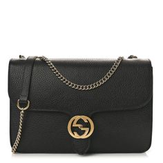 This is an authentic GUCCI Dollar Calfskin Interlocking G Shoulder Bag in Black.This chic shoulder bag is crafted of beautifully grainedblack calfskin leather. The bag features a polished silver chain linkshoulder strap with a leather shoulder pad, and a silver interlocking G flip-lock on the crossover flap. This opens the bag to a partitioned beige fabric interior with a zipper pocket. Shoulder Bag Black, Beige Fabric, Shoulder Pads, Crossover, Zipper Pocket, Silver Chain, Calf Skin, Shoulder Strap, Purse