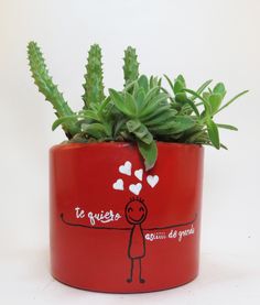 a potted plant with hearts on it and the words la quieste written in spanish