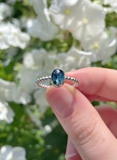 This ring is handmade by me using 925 sterling silver. It has a 2 mm wide beaded ring band and is set with an oval moss kyanite (6x8 mm) in a beautiful shade of teal. This ring is a size 8 (US) and has an inside diameter of 18 mm. Inside ring diameter: 18 mm (US size 8) Ring band width: 2 mm Stone size: 6x8 mm Love this ring, but it's not your size? Send me a message and I'll let you know what the options are! - Every piece in my shop is made by hand, which makes them unique and perfectly imperf Handmade Blue Crystal Ring In Sterling Silver, Handmade Blue Topaz Ring In Sterling Silver, Dainty Blue Sapphire Ring In Sterling Silver, Blue Sapphire Ring In Sterling Silver, Blue Sapphire Ring In Sterling Silver, Dainty Style, Ring With Blue Stone, Large Stone Rings, Beaded Ring, Use Of Plastic