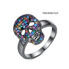 Color Iced Stainless Cubic Zirconia Glam Gothic Punk Skull Ring Sizes 7 8 & 9 New & Sealed! This Is The One Of The Coolest Modern Skull Rings We Sell. The Colors On This This Ring And It’s Minimalist Design Make It Versatile For Wearing Or Gifting On Any Occasion. It Spans Styles From Biker Punk To Glam Gothic To Elegantly Sublime. See Our Other Listings For The Dark Silver Anodized Colorful Cz Version Of This Ring And Matching Necklaces. Ships Free, New And Sealed In A Black Velvet Jewelry Pouc Black Skull Ring For Halloween, Gothic Black Rings With Skull Print, Halloween Black Skull Ring, Punk Style Black Skull Ring Gift, Black Halloween Rings With Skull Print, Black Skull Print Rings For Halloween, Halloween Black Rings With Skull Print, Edgy Black Skull Ring For Halloween, Black Skull Rings In Punk Style