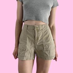 Vintage Gap Tan Cargo Outdoor Shorts Button/zipper closure with pockets. Great condition with light wear/distress  Brand - Gap Tag size - 6 Seen on size small, 5'4 with waist pinned Measurements (laying flat) Waist (no pull) 14.5 in - (taut) 15.5 in Hips (3 inches above crotch seam) - 19 in Rise - 9 in Inseam - 4 in  Leg opening - 11.25 in Recommend for a 30" low-mid waist depending on desired fit #outdoorshorts #hikingshorts #granolagirl #cargoshorts #tancargoshorts High Rise Cotton Cargo Shorts Casual, High Rise Casual Cotton Cargo Shorts, High Rise Cotton Cargo Shorts Casual Style, Casual High Rise Cotton Cargo Shorts, High Rise Casual Cargo Shorts With Built-in Shorts, Casual Mid-rise Cargo Shorts With Pockets, Casual High Rise Cargo Shorts With Pockets, Casual High Rise Cargo Style Shorts, Casual High-rise Cargo Shorts