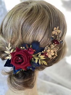 a close up of a woman's head with flowers in her hair