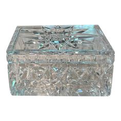 a clear glass box with an intricate design