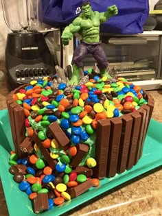 there is a cake made to look like the incredible hulk - man with candy and candies