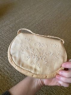 Set of two early 20th century handbags with floral embroidery. One with colorful flowers and one with white. Smaller bag includes a silk hanky from the original owner, but has a stain spot inside, shown in photo Vintage Embroidered Rectangular Clutch, Vintage Embroidered Pouch Evening Bag, Vintage Beige Pouch Clutch, Vintage Embroidered Clutch Evening Bag, Vintage Cream Bag For Gift, Vintage Cream Clutch Bag, Vintage Beige Handmade Evening Bag, Vintage Beige Embroidered Shoulder Bag, Vintage Embroidered Clutch For Formal Events