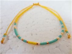 "This Morse Code bracelet spells out Dont Worry in dots and dashes (Morse Code). What a great gift for that someone in your life who could use a little uplifting whether it's your best friend, your mom, your sister, your girlfriend, or yourself. It's made with fine nylon knotting cord and tiny Japanese Delica glass beads in a colorful combination with gold spacers. The sliding knot makes the bracelet adjustable and easy to get on and take off. Great for yourself or gift giving. The bracelet adju Yellow Beaded Bracelets With Sliding Knot As Gift, Yellow Beaded Bracelets With Sliding Knot For Gifts, Yellow Beaded Bracelet With Sliding Knot As Gift, Adjustable Yellow Bracelets For Friendship, Adjustable Yellow Bracelet For Friendship, Adjustable Yellow Beaded Bracelet With Sliding Knot, Yellow Adjustable Cord Bracelet, Yellow Sliding Knot Bracelet, Yellow Adjustable Friendship Bracelets As Gift