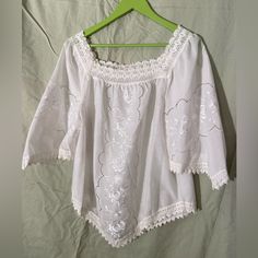 Gorgeous White Embroidered Traditional Blouse From Greece, Never Worn. Size Is M For Looser Fit, Could Fit L. Across Chest In Front - 20”. Length From Shoulders To The Tip At The Bottom 29”. Shoulder To The Side Bottom - 22” Embroidered Cotton Lace Top For Summer, Summer Embroidered Cotton Lace Top, Spring Embroidered Cotton Lace Top, Spring Short Sleeve Blouse With Chikankari Embroidery, Spring Chikankari Embroidered Short Sleeve Blouse, Cotton Tops With Floral Embroidery For Daywear, Bohemian Blouse With Broderie Anglaise Short Sleeves, Embroidered Short Sleeve Tops For Daywear, Summer Broderie Anglaise Embroidered Top For Daywear