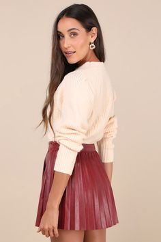 The Lulus Chic Edge Burgundy Vegan Leather Pleated High-Rise Mini Skirt calls in admirers all day long! Smooth vegan leather shapes this stylish skirt with a high, banded waist and an A-line silhouette with a classic pleated design. Perfect mini hem completes the look. Hidden side zipper/clasp. Pair to perfection with your favorite knee-high boots! Fit: This garment fits true to size. Length: Mid-thigh. Size medium measures 15.50" from waist to hem. Waist: Fitted - very fitted at natural waist. Maroon Skirt Outfit, Pleated Skirt Outfit Work, Red Leather Skirt Outfit, Pleated Leather Skirt Outfit, Burgundy Skirt Outfit, Anna Herrin, Red Leather Skirt, Maroon Skirt, Pleated Skirt Outfit