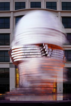 a large white object in front of a building