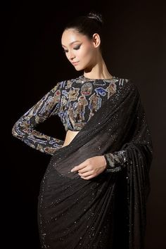 Black net pre-stitched saree with crystal embellishments. Comes with a silver blouse. - Aza Fashions Glamorous Black Embellished Pre-draped Saree, Black Embellished Pre-draped Saree, Evening Glamorous Blouse With Resham Embroidery, Glamorous Evening Blouse With Resham Embroidery, Embellished Black Pre-draped Saree For Reception, Black Embellished Fitted Saree, Fitted Black Embellished Saree, Evening Blouse With Mirror Work And Semi-stitched Fit, Black Blouse With Resham Embroidery For Evening