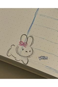 a drawing of a bunny with a pink bow on it's head is shown