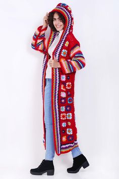 Long, flowing design for a stylish and comfortable look. Hooded for added warmth and a trendy touch. Soft and cozy fabric for a pleasant feel. Suitable for various occasions. Great gift option for fashion-forward individuals. Amazing colorful handmade crochet long jacket. Materials: high-quality yarn, probably wool or wool blend Bohemian Long Knitted Sweater Coat, Bohemian Long Knit Outerwear, Cozy Crochet Outerwear One Size, Red Crochet Long Sleeve Outerwear, Red Bohemian Crochet Outerwear, Bohemian Winter Cardigan With Pockets, Long Multicolor Knit Outerwear, Multicolor Long Knit Outerwear, Casual Crochet Hooded Outerwear