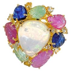 Bochic "Capri” Opal & Multi Color Sapphire Cocktail Ring Set In 18K Gold & Silver Multi natural gem Ring Beautiful Natural Opal - 5 carats Natural Multi Color Sapphires from Sri Lanka, Emeralds from Zambia and Rubies - 7 carats This Ring is perfect to wear - Day to night, swim wear to evening wear. Crafted in 18 karat gold and silver with purity marks. You will steal the show with this Ring and you will add a little something extra to your favorite caftan, swim suit or evening wear. We made a this special Ring for a traveling collection called "Capri” The collection is set in 18 Gold & Silver - And has Natural Gem stones. The price points are fantastic Comes with a certificate Comes with an appraisal Comes with a Bochic Champagne & Satin Ring Case Signed One of the standout aspects of this Sapphire Cocktail Ring, Special Ring, Gem Ring, Zambia, Ring Set, Natural Opal, Cocktail Rings, Ring Sets, Capri