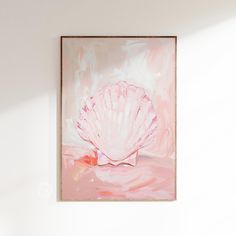 a pink painting hanging on the wall