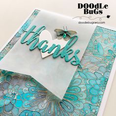 a close up of a thank you card with butterflies and flowers on the front side