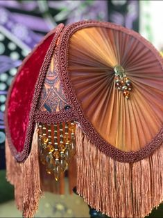 a close up of a decorative lamp with tassels