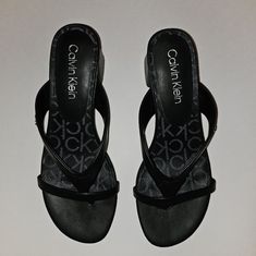 Brand New W/O Tag! These Are Calvin Klein T-Strap Sandals With A 2in Block Heel. It's Cute, But Sadly Too Big For Me. I Bought Them Even Though They Were Too Big And Never Wore Them Because I Couldn't Keep Them On. Please Don't Hesitate To Ask Any Questions. Thank You For Checking Out My Closet! Calvin Klein Black Sandals For Summer, Calvin Klein Black Open Toe Sandals, Synthetic T-strap Sandals With Branded Insole, Calvin Klein Black Leather Sandals, Black Leather Calvin Klein Sandals, Calvin Klein Open Toe Sandals With Cushioned Footbed, Calvin Klein Open Toe Sandals With Branded Insole, Calvin Klein Sandals With Heel Strap And Round Toe, Black Low Heel Sandals With Branded Insole