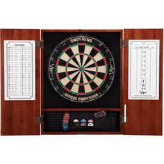 a dart board with darts and score cards