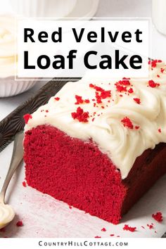 red velvet loaf cake with white frosting and sprinkles