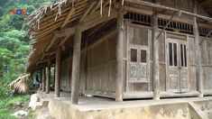 an old wooden building in the woods