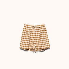 Our gingham sleepwear is woven from 100% French flax linen and pre-washed for extra softness. The Esme Short is a modern take on classic boxers with a high rise relaxed fit and faux button fly. Gingham Cotton Shorts For Daywear, Cotton Gingham Pajama Shorts With Elastic Waistband, Plaid Cotton Shorts For Daywear, Plaid Cotton Summer Sleepwear, Summer Plaid Shorts With Elastic Waistband, Cotton Gingham Shorts For Loungewear, Summer Shorts With Elastic Waistband For Picnic, Summer Gingham Cotton Sleepwear, Summer Picnic Shorts With Elastic Waistband