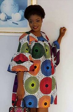 Ankara dress is a type of dress that is made from Ankara fabric, which is a colorful cotton fabric with various patterns and designs. Ankara fabric is also known as African wax print, Dutch wax, or African print1. Ankara dress is popular among African women, especially in Nigeria, Ghana, and other West African countries. Ankara dress can be worn for different occasions, such as weddings, parties, casual outings, and cultural events. Ankara dress can be styled in various ways, such as short dress Multicolor Print Cotton Dress For Vacation, Multicolor Printed Knee-length Mini Dress, Multicolor Vibrant Print Knee-length Mini Dress, Multicolor Knee-length Mini Dress With Vibrant Print, Multicolor Cotton Midi Dress For Beach, Multicolor Cotton Maxi Dress For Vacation, Vibrant Multicolor Print Knee-length Dress, Multicolor Vibrant Print Knee-length Dress, Multicolor Cotton Maxi Dress With Floral Print