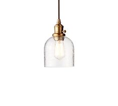 a small glass light fixture hanging from a metal ceiling lamp with an aged brass finish