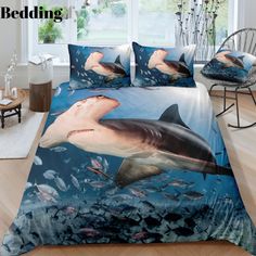 a bed with a shark and fish on it