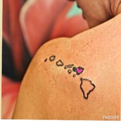 a woman with a tattoo on her back that says africa and hearts in the shape of a map