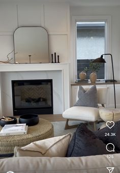 a living room filled with furniture and a fire place in front of a tv mounted above a fireplace